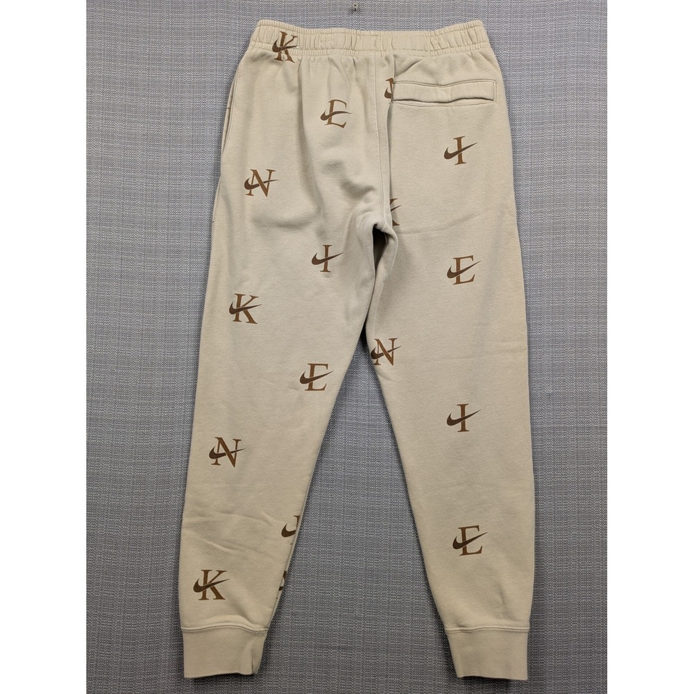 Nike Sportswear All Over Logo Print Fleece Joggers Tan Brown Mens Small